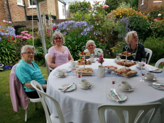 Photos of The Richmond Charities' Afternoon tea with bubbles in the award-winning garden at Michel's Almshouses